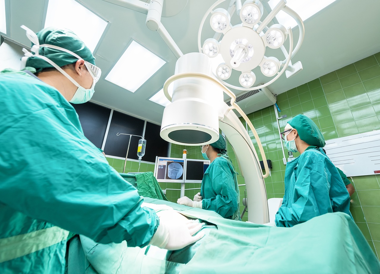 a group of surgeons in a operating room